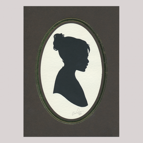 
        Front of silhouette, with girl in frame looking right.